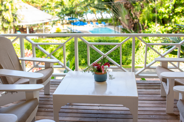 Veranda view over the pool & beach entrance